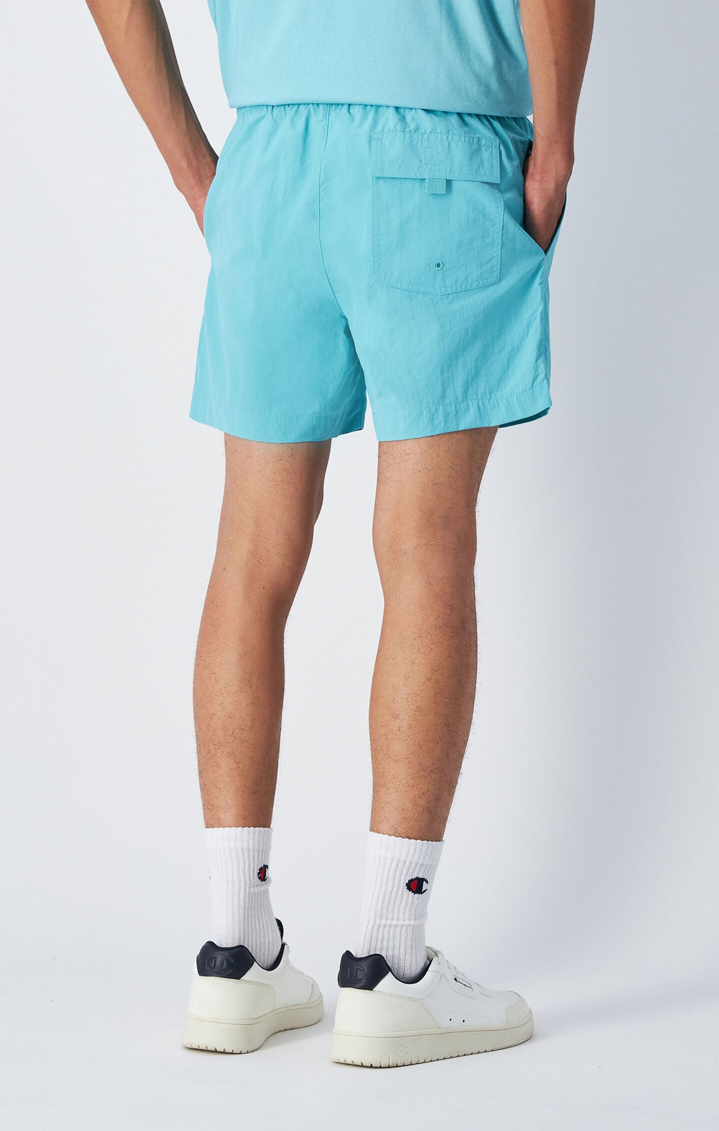Pantaloneta de playa con logo pequeño