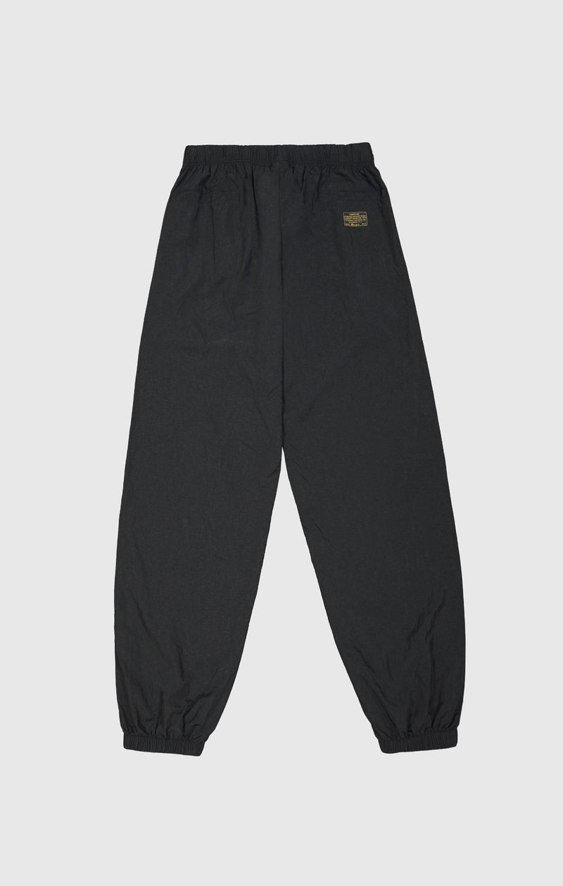 Pantalón de nailon con puños elásticos