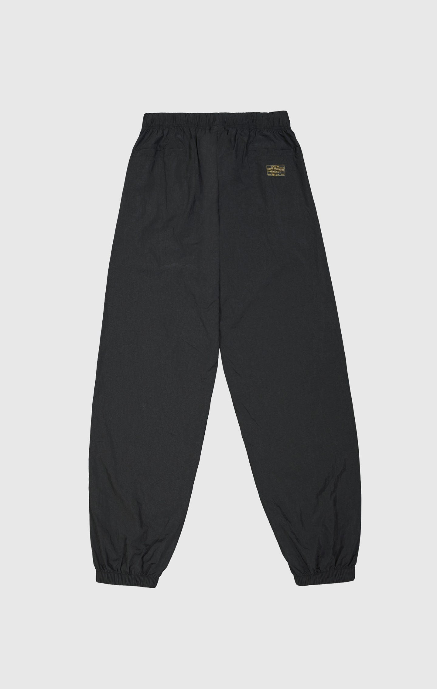 Pantalón de nailon con puños elásticos