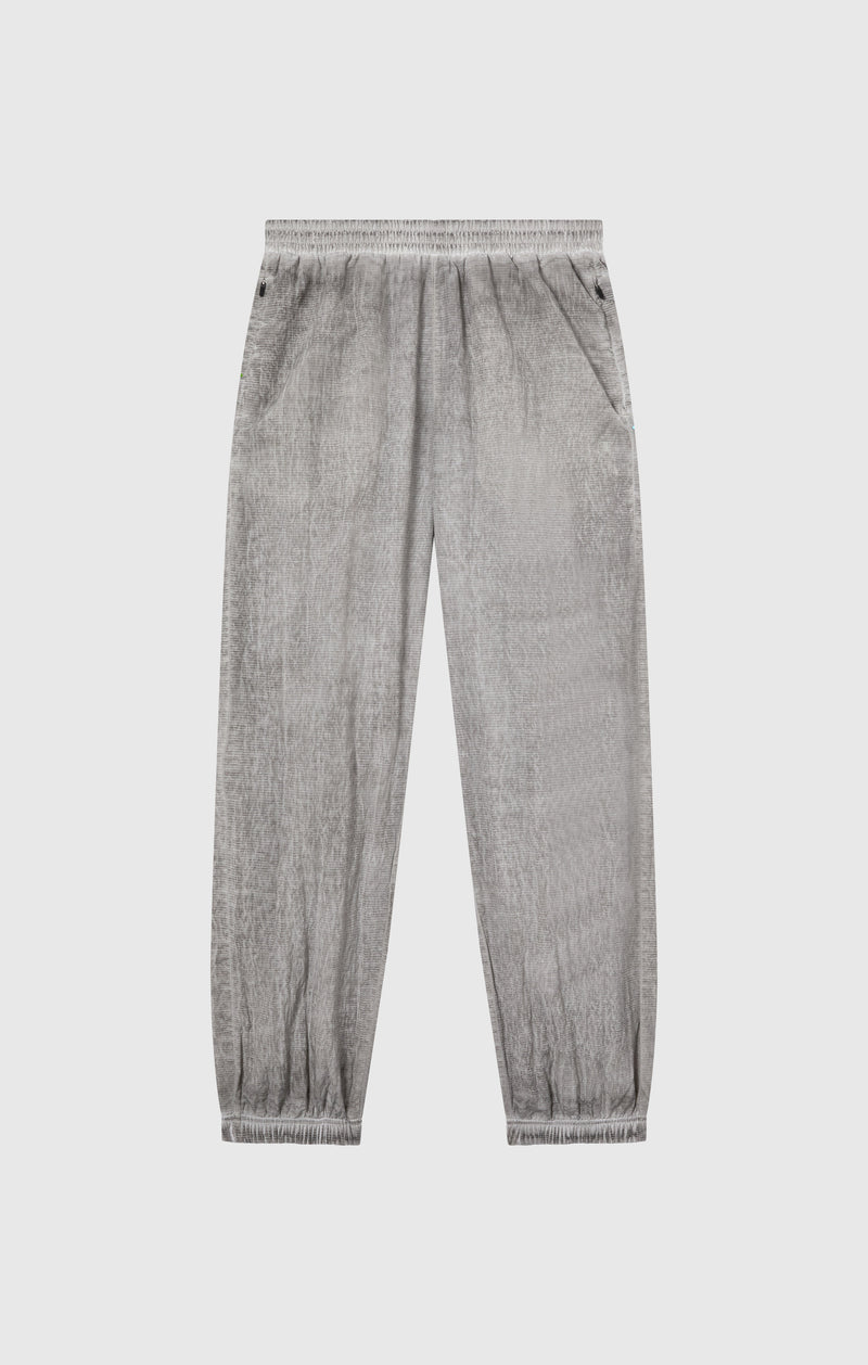 Pantaloni Uomo In Nylon Con Polsini Elastici Effetto Slavato