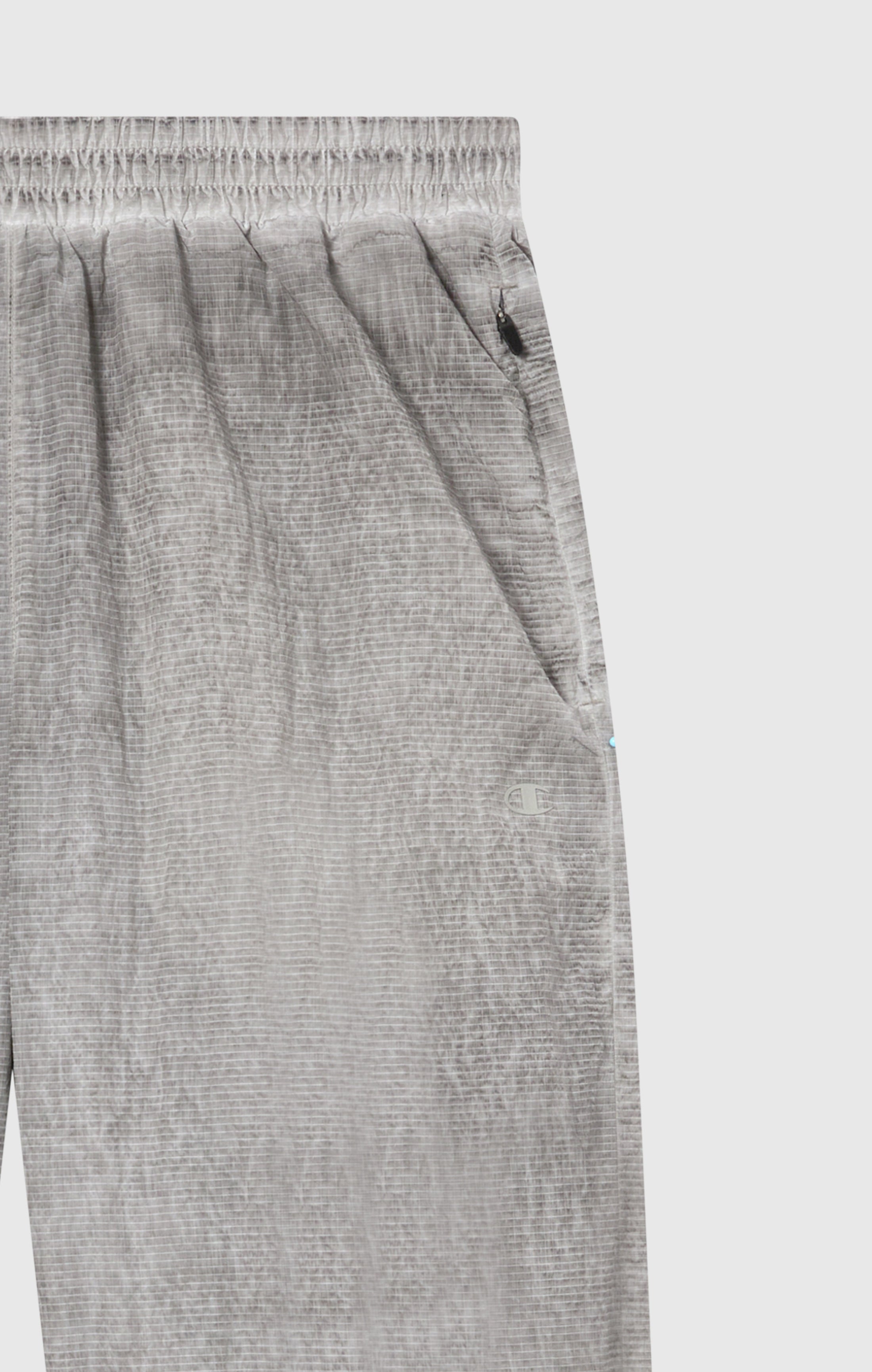 Pantaloni Uomo In Nylon Con Polsini Elastici Effetto Slavato