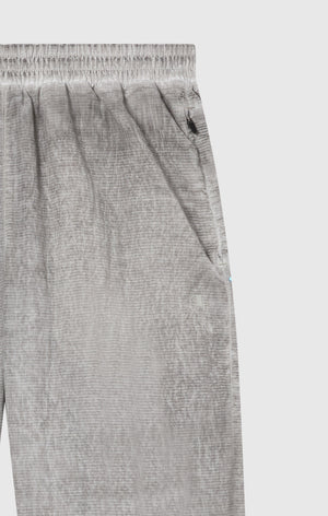 Pantaloni Uomo In Nylon Con Polsini Elastici Effetto Slavato