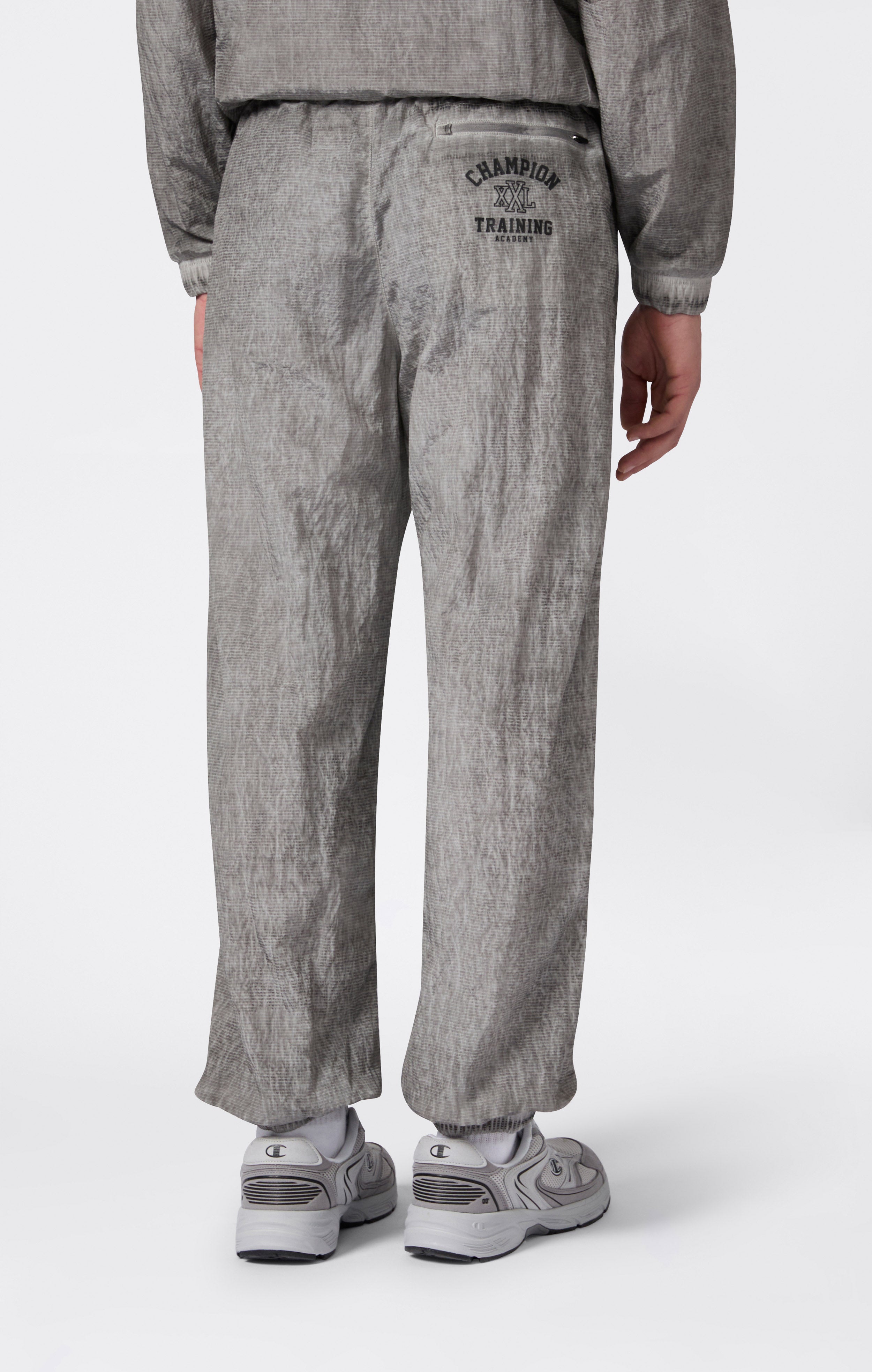 Pantaloni Uomo In Nylon Con Polsini Elastici Effetto Slavato