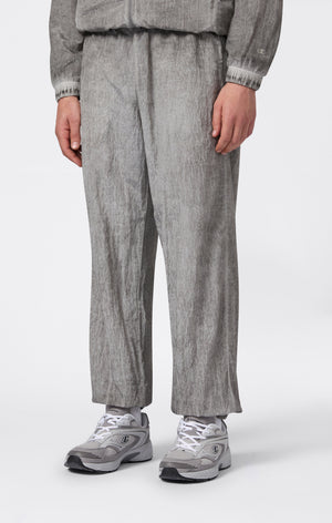 Pantaloni Uomo In Nylon Con Polsini Elastici Effetto Slavato