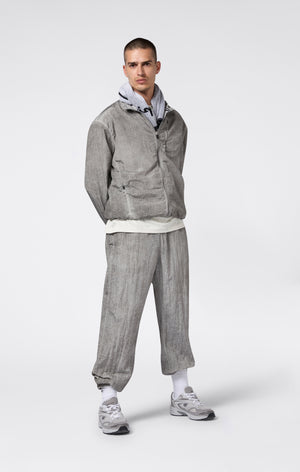 Pantaloni Uomo In Nylon Con Polsini Elastici Effetto Slavato