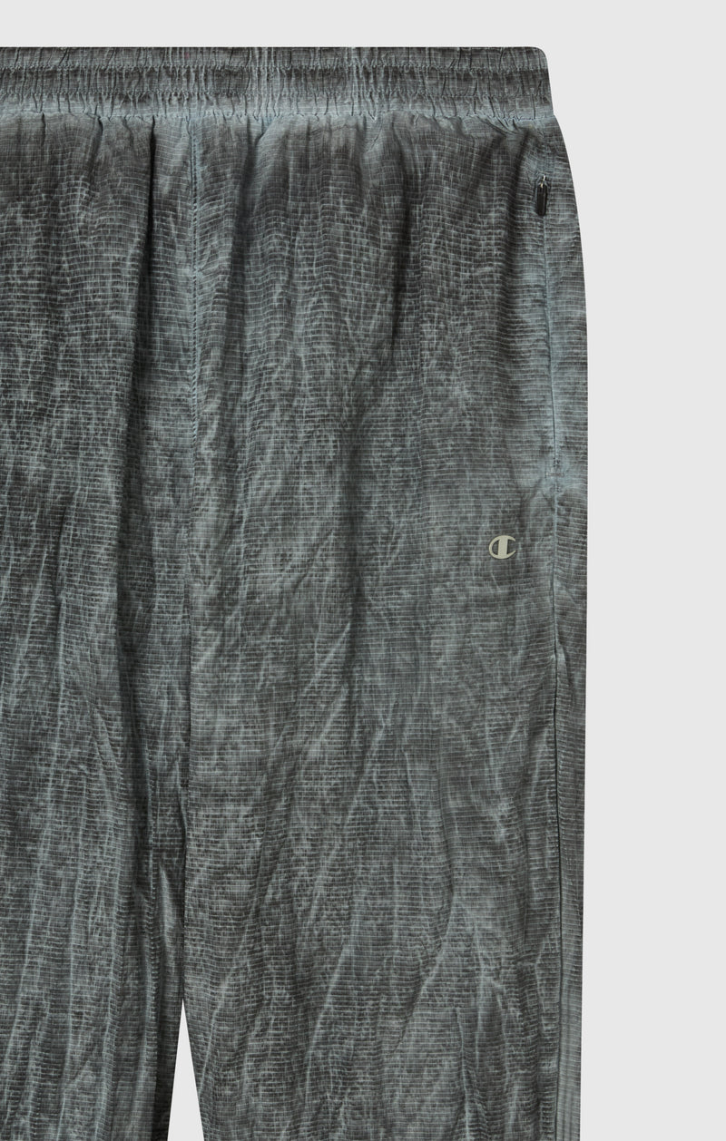 Pantaloni Uomo In Nylon Con Polsini Elastici Effetto Slavato