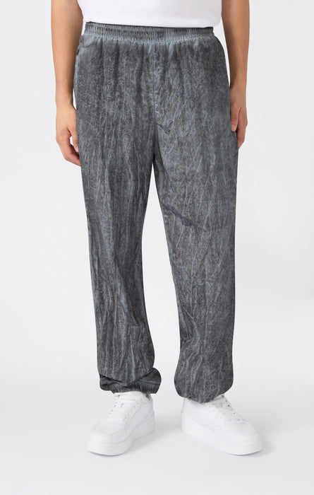 Pantaloni Uomo In Nylon Con Polsini Elastici Effetto Slavato